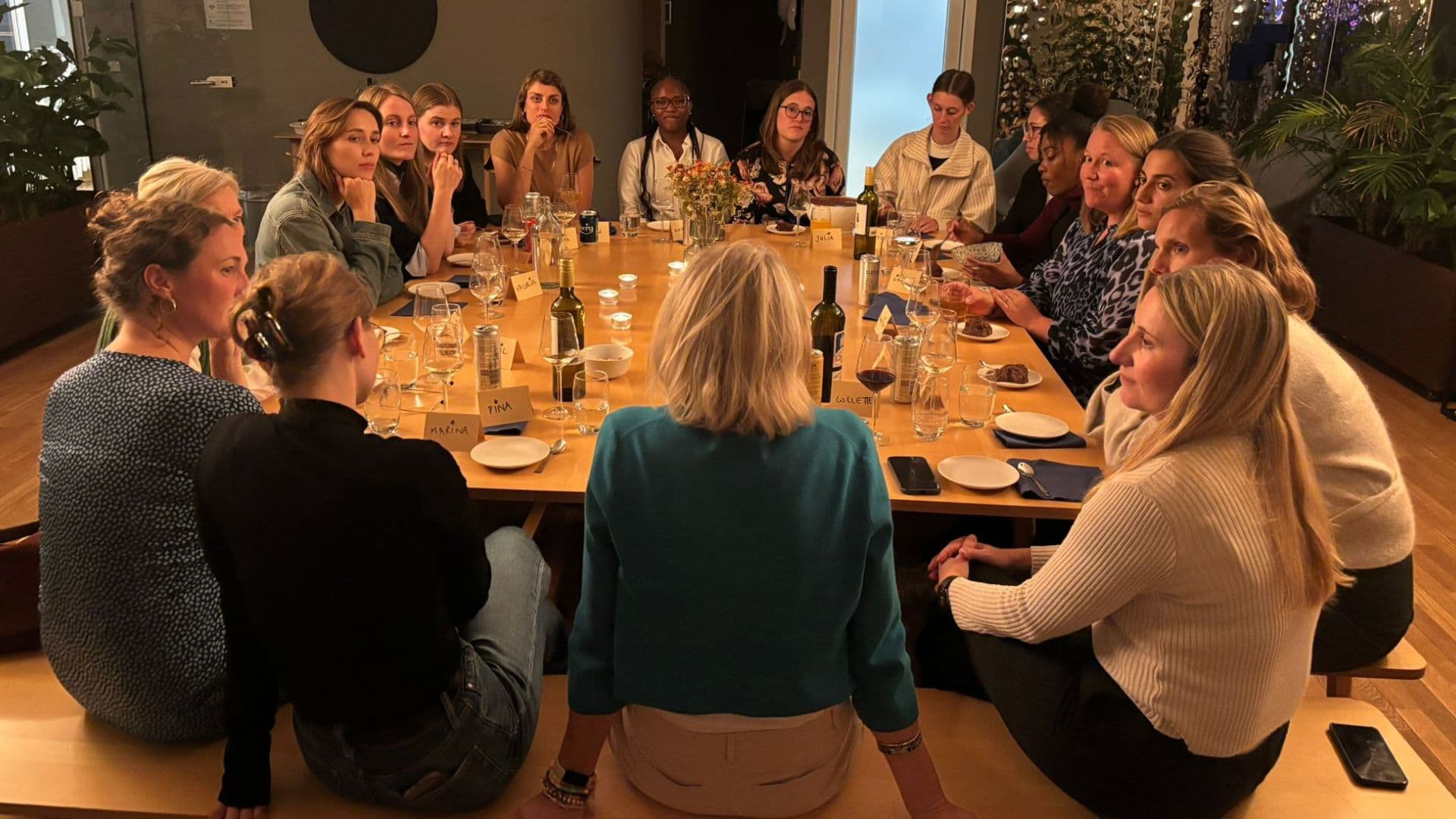Women enjoying dinner together at Mad Money Club